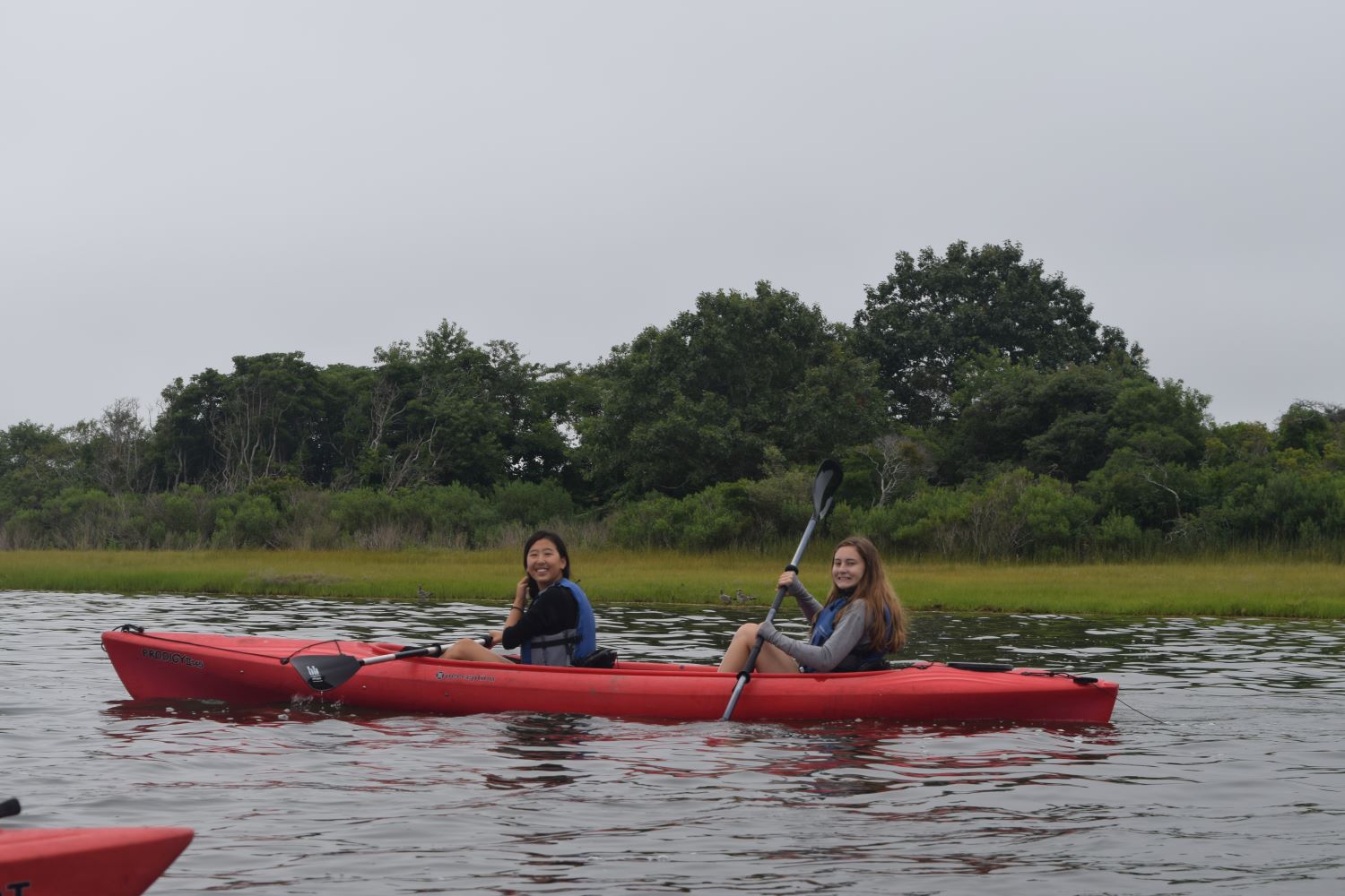 Eugena and Makkia kayaking. (Courtesy WHOI)
