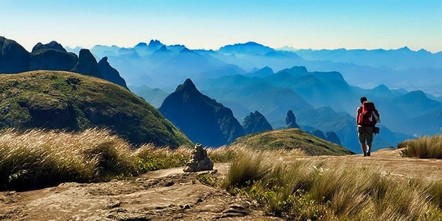 A man hiking through the mountains in Brazil.