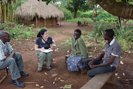 An Earthwatch volunteer talking to the local people, recording their knowledge on chimpanzees (credit Dustin Colson).