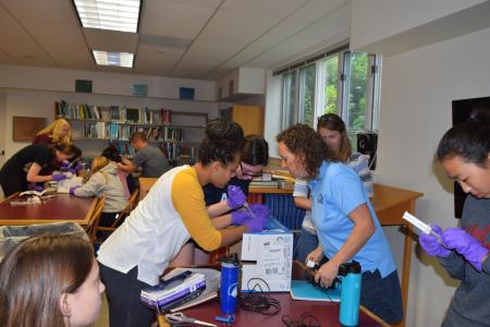 The Girls in Science fellows build hydrophones with the help of field team leader Grace Simpkins of Woods Hole Sea Grant. (Courtesy WHOI)
