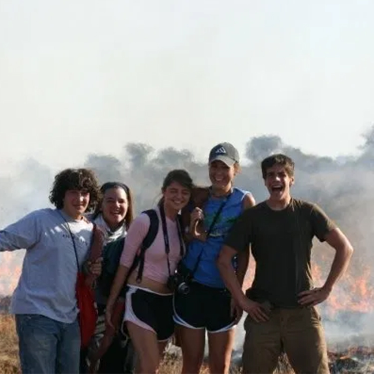 A team of Earthwatch volunteers during a patrol of a controlled burn while on the expedition South Africa’s Hyenas.