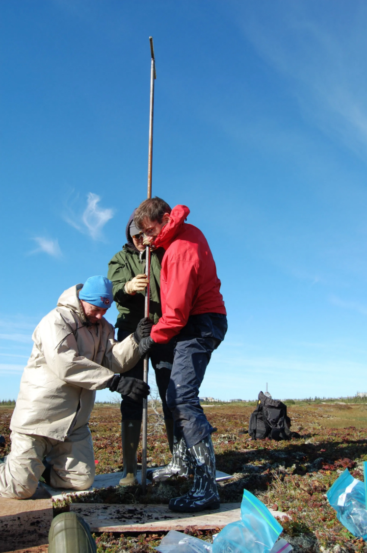 Volunteers take soil and gas measurements in the Arctic.