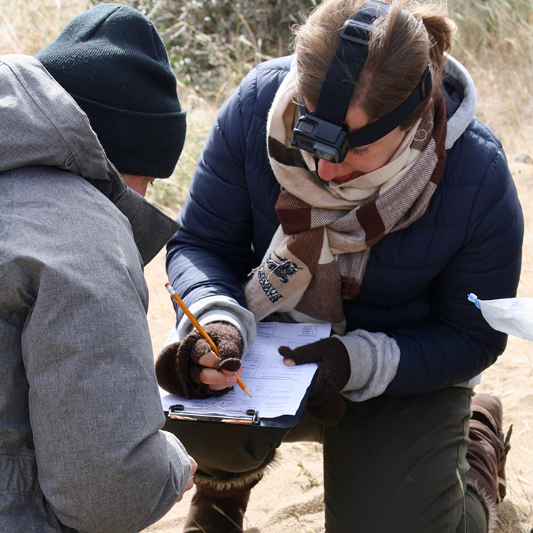 Amanda writes down data collected while in the field on the expedition Wildlife of the Mongolian Steppe.