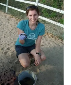 Kimberley with a baby turtle after hatching.