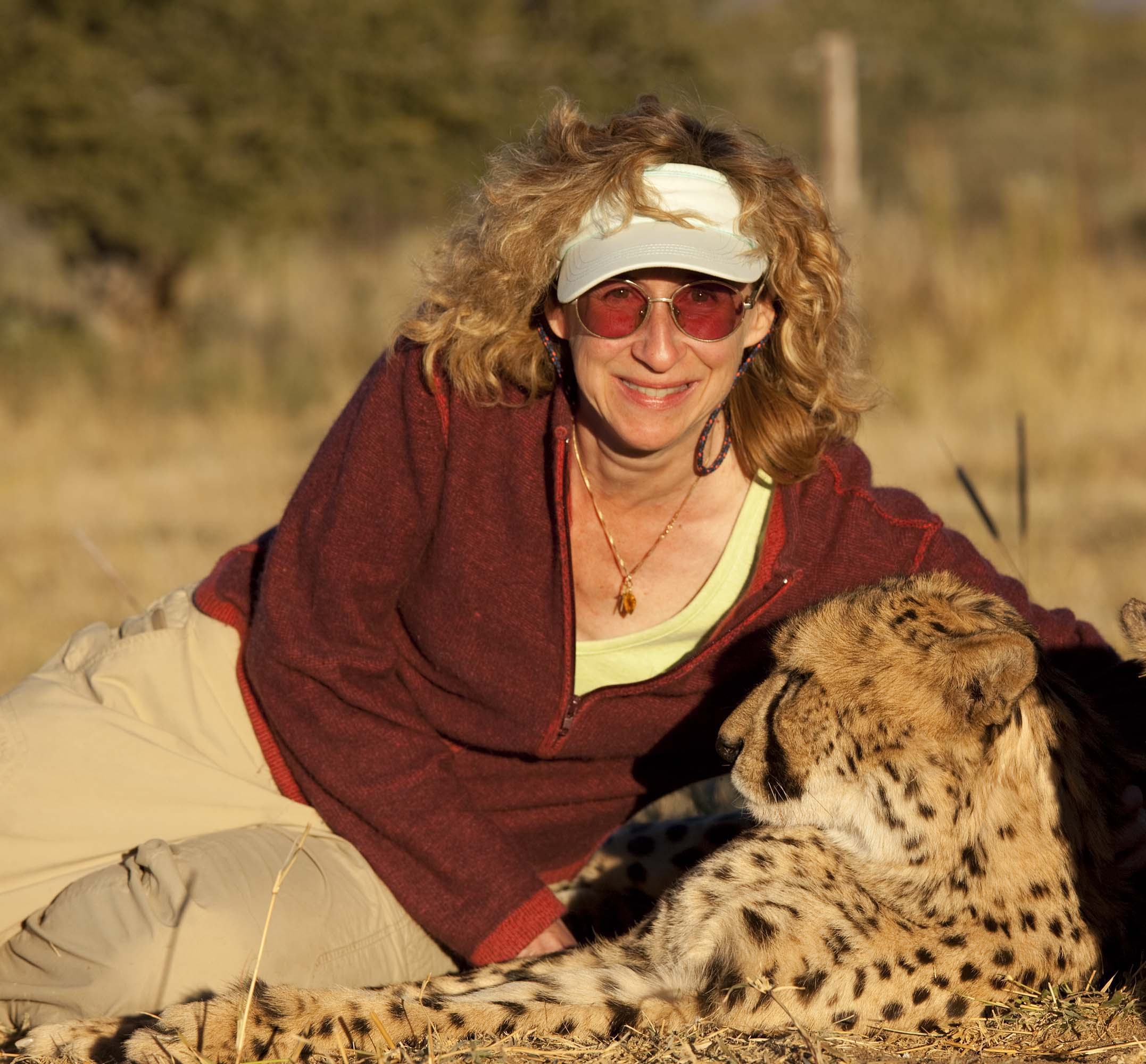 Sy with the Cheetah Conservation Fund’s ambassador cat. (Courtesy Nic Bishop)