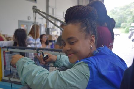 Dominique tests the hydrophone she built with her teammate Amelia during the Girls in Science fellowship. (Courtesy Grace Simpkins/WHOI Sea Grant)