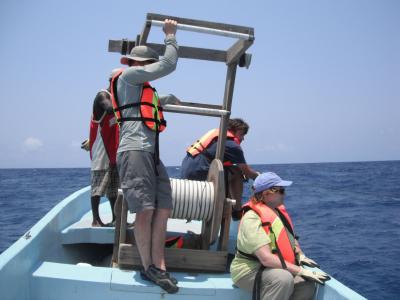 volunteers on a research boat in belize