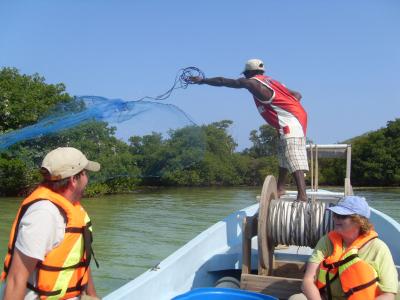 volunteers in a research boat off belize