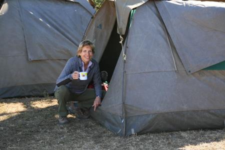 earthwatch volunteer outside tent