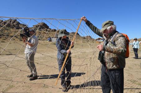 Earthwatch volunteers practice setting up netting