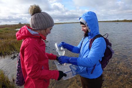 Earthwatch volunteers collecting water data