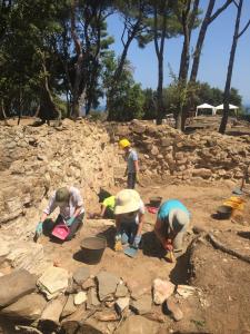 Earthwatch volunteers helping to excavate ancient artifacts