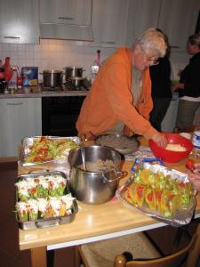 An Earthwatch volunteer helps prepare dinner