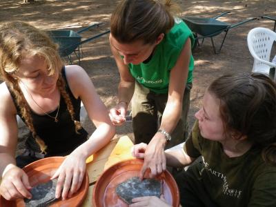 Earthwatch volunteers working to reconstruct the original vessel of pieces of pottery they found (credit Rowena Millard)