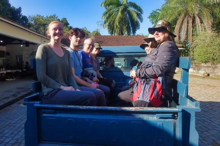 Earthwatch volunteers in the back of the truck, ready to head into the field.