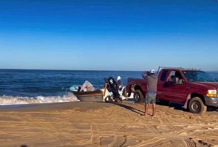 Research boat launch at Punta Lobos with assistance from the local fishermen's cooperative.