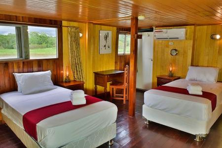 All cabins have single beds (no bunk or double beds), air-conditioning (runs only while the generator is on), a desk, and a wardrobe. credit Luis Perez