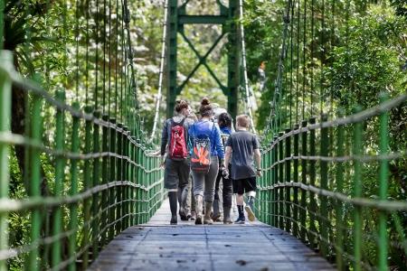A group of teens enjoy a walk on a hanging bridge in Costa Rica © Curtis Creager | Earthwatch