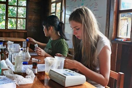 Teen participants work in the lab in Ecuador. © Mike Mao | Earthwatch