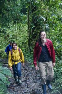 Three teen participants hike through the forest in Ecuador. | Earthwatch