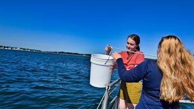 Two teen girls on a research vessel in Woods Hole, MA (C) Whoi