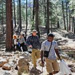 A group of students walking to the field site in Arizona with their teacher.